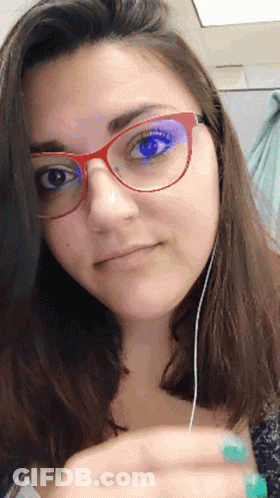 Woman With Glasses And Earbuds GIF