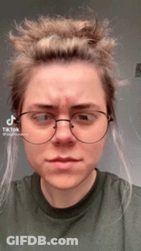 Woman With Glasses And Green Shirt With TikTok Sticker On Face GIF