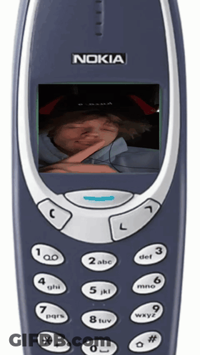 Woman With Glasses And Hat Holding Flip Phone GIF