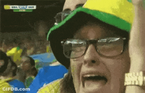 Woman With Glasses And Hat Watching Soccer In Brazil GIF