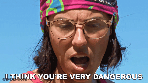 Woman With Glasses And Headband Saying I Think You're Very Dangerous GIF