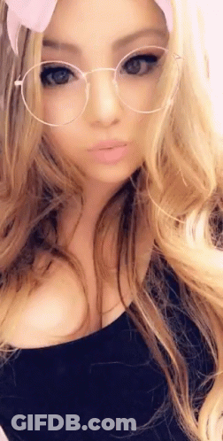 Woman With Glasses And Headband Taking Selfie GIF