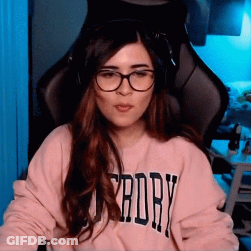 Woman With Glasses And Headphones At Computer GIF
