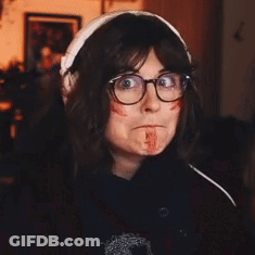 Woman With Glasses And Headphones Bloodied Face GIF