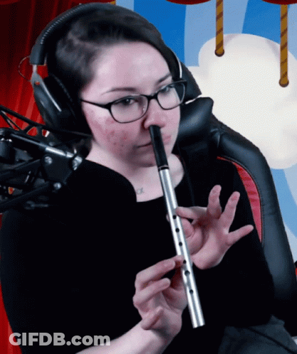 Woman With Glasses And Headphones Playing Flute GIF