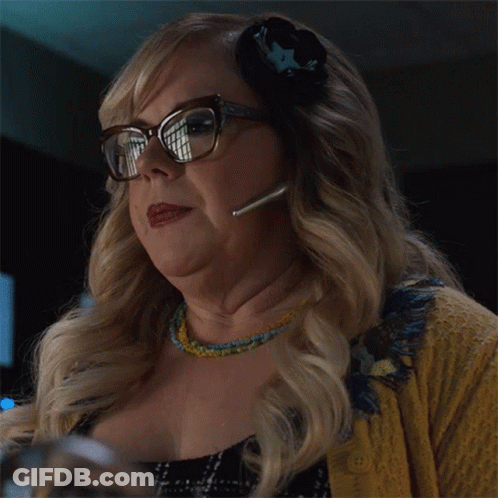 Woman With Glasses And Headset Looks At Something GIF