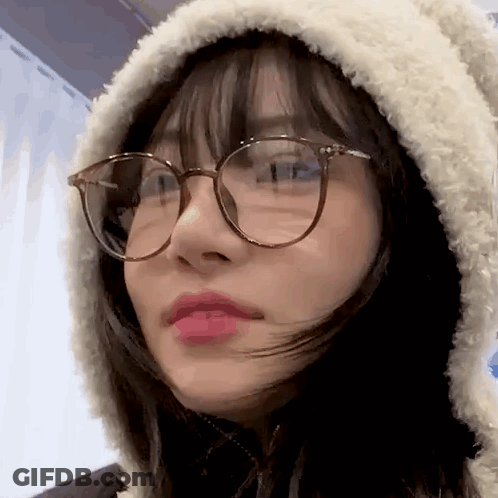 Woman With Glasses And Hooded Jacket GIF