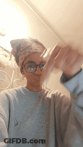 Woman With Glasses And Louis Vuitton Headband GIF