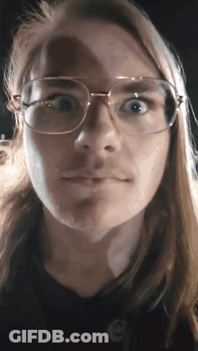 Woman With Glasses And Mustache Making Funny Face GIF
