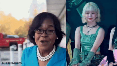 Woman With Glasses And Pearl Necklace Beside Woman In Green Dress GIF