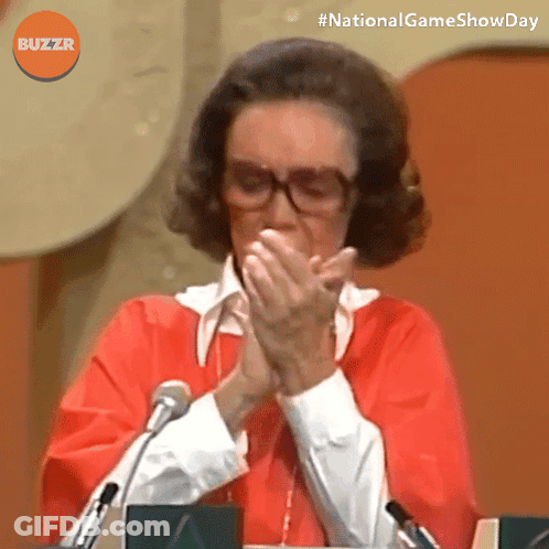 Woman With Glasses And Red Shirt Clapping In Front Of Microphone GIF