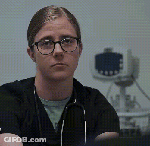 Woman With Glasses And Stethoscope Looking At Camera GIF