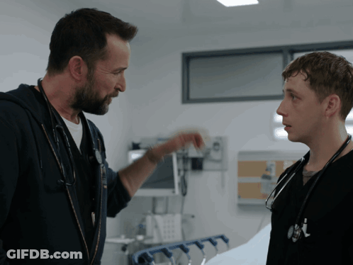 Woman With Glasses And Stethoscope Looks At Camera GIF