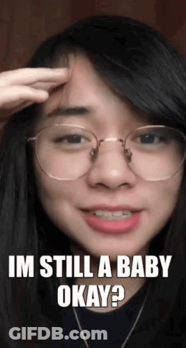 Woman With Glasses Asking If She's Still A Baby GIF