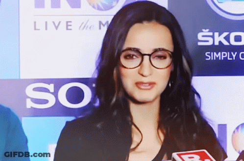 Woman With Glasses At Live The M Sign GIF