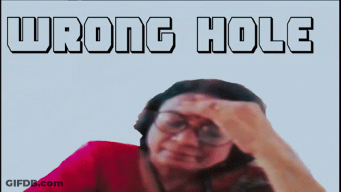 Woman With Glasses Hand To Forehead Saying Wrong Hole GIF