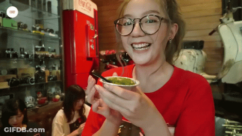 Woman With Glasses Holding Green Drink GIF