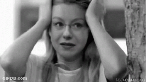 Woman With Glasses Holding Head GIF