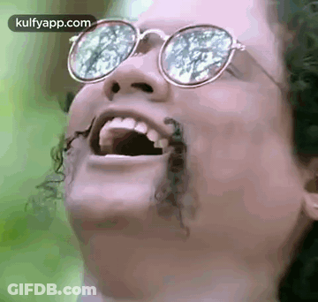 Woman With Glasses Laughing Bug Coming Out Of Mouth GIF