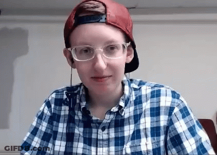 Woman With Glasses Looking At Camera GIF