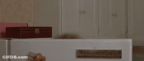 Woman With Glasses Looking Out Window GIF