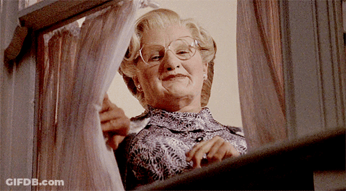 Woman With Glasses Looking Out Window GIF