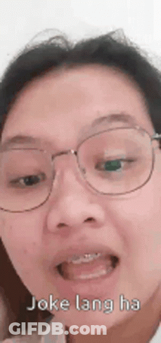 Woman With Glasses Making Funny Face GIF