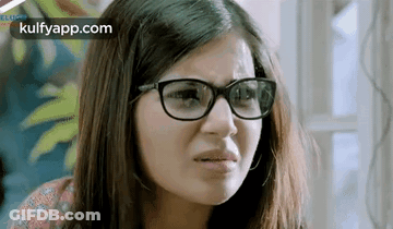 Woman With Glasses Making Funny Face GIF