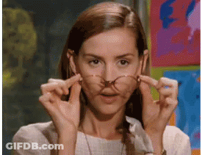 Woman With Glasses Making Funny Face GIF