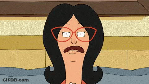 Woman With Glasses Making Funny Face GIF