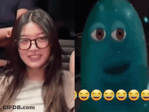 Woman With Glasses Next To Blue Cartoon Character GIF