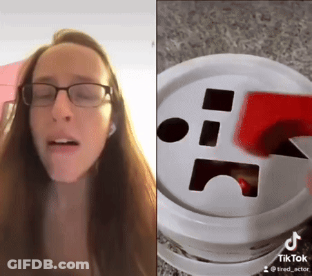 Woman With Glasses Next To Tik Tok Bucket GIF