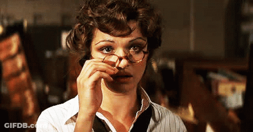 Woman With Glasses On Phone GIF