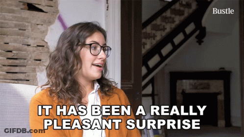 Woman With Glasses Saying Pleasant Surprise GIF