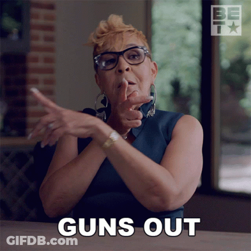 Woman With Glasses Says Guns Out GIF