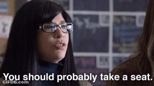 Woman With Glasses Says You Should Probably Take Seat GIF