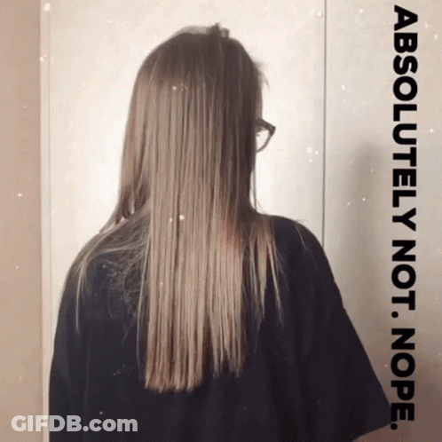 Woman With Glasses Standing Before Absolutely Not Nope Sign GIF