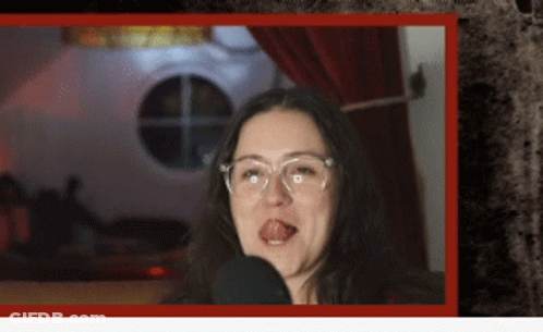 Woman With Glasses Sticking Tongue Out GIF
