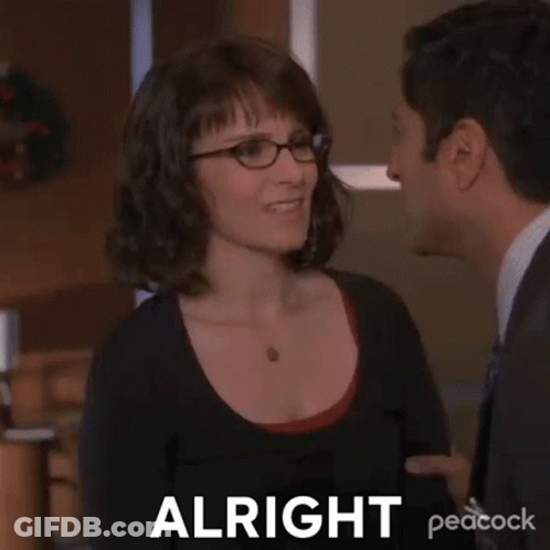 Woman With Glasses Telling Man In Suit Alright GIF
