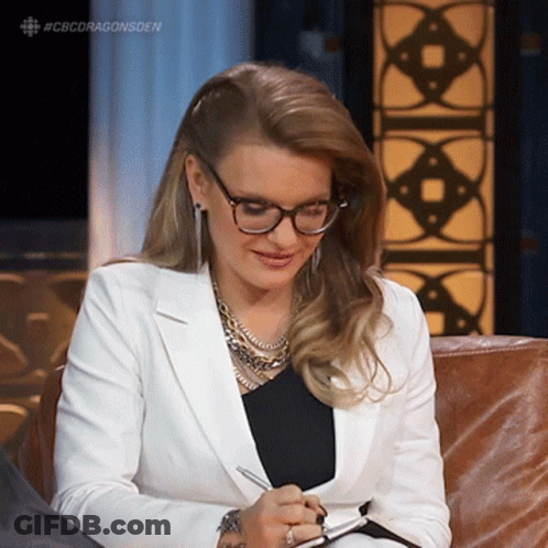 Woman With Glasses Writing In Notebook GIF