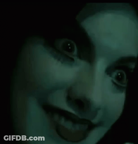 Woman With Glowing Eyes And Tongue Out GIF