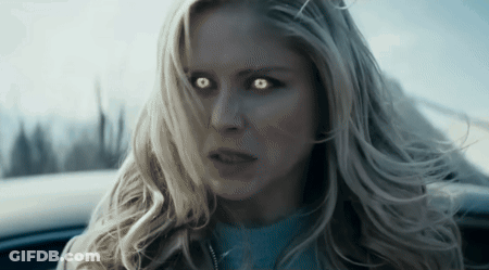 Woman With Glowing Eyes Looking At Camera GIF
