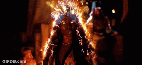 Woman With Gold Crown And Earrings Dancing GIF