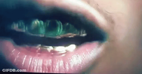 Woman With Gold Teeth And Black Lipstick GIF