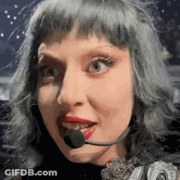 Woman With Gray Hair And Red Lips Wearing Headset Microphone GIF