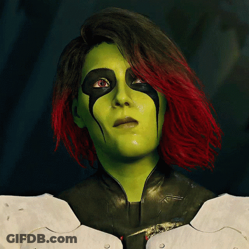 Woman With Green And Red Hair In Costume GIF