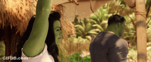 Woman With Green Arms Next To Man GIF
