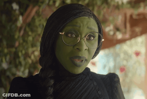 Woman With Green Face Paint And Glasses In Black Dress GIF