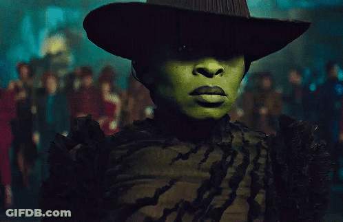 Woman With Green Face Paint And Hat GIF