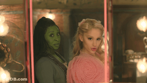 Woman With Green Face Standing Next To Woman GIF